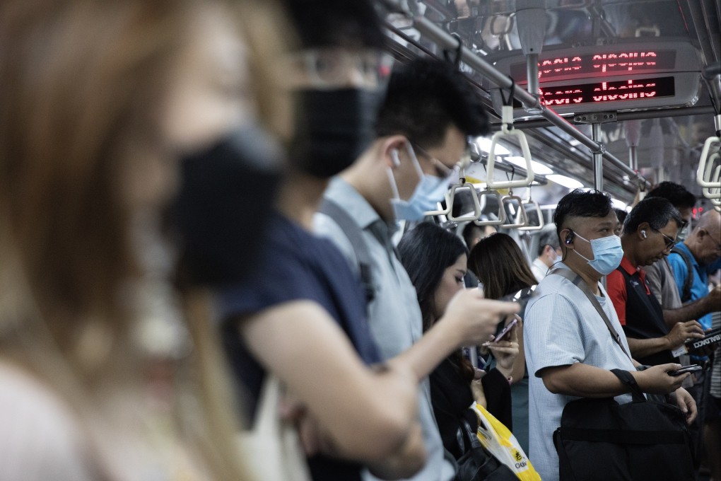 Most commuters on Singapore’s MRT trains were wearing a mask on Monday. Photo: EPA-EFE