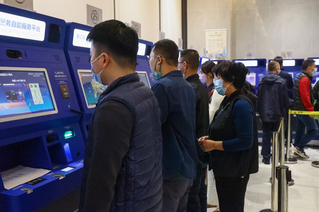People use the self-service machines to get their Hong Kong entry visa renewed at the 24 hours self-service area at Futian Sub-bureau of Shenzhen Public Security Bureau. Photo: SCMP/ Dickson Lee