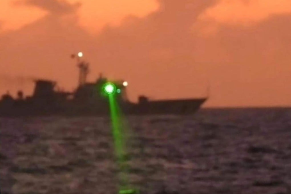 A Chinese coastguard vessel shining a “military-grade laser light” at a Philippine boat in the Spratly Islands, South China Sea. Photo: PCG/AFP