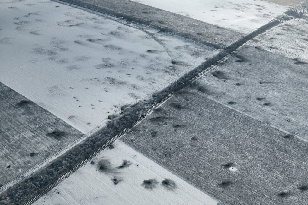 Craters left by shelling covers a field on the front line close to Bakhmut, Ukraine. Photo: AP