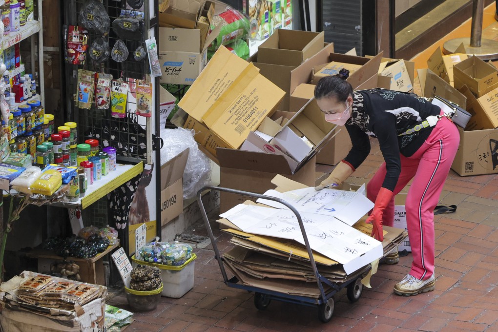 A woman collects cardboard in Mong Kok on January 10. For many low-wage earners, life was already difficult before Covid-19 exacerbated the situation. Photo: Jelly Tse