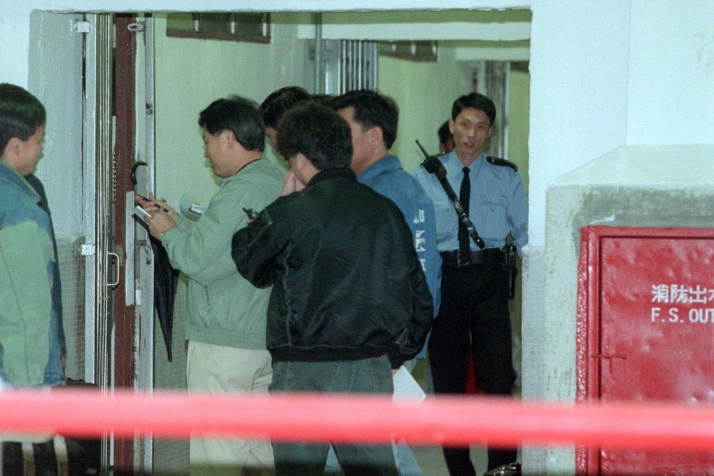 Hong Kong police at the door of a flat inside which they found a man’s dismembered body in a trunkful of salt. His common-law wife was later convicted of manslaughter and sentenced to 10 years in prison. Photo: SCMP