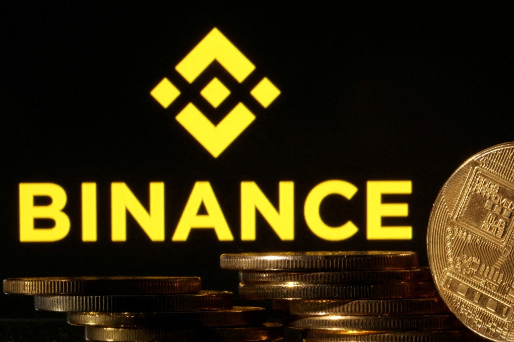 Representations of cryptocurrencies seen in front of a Binance logo in an illustration taken on November 10, 2022. Photo: Reuters