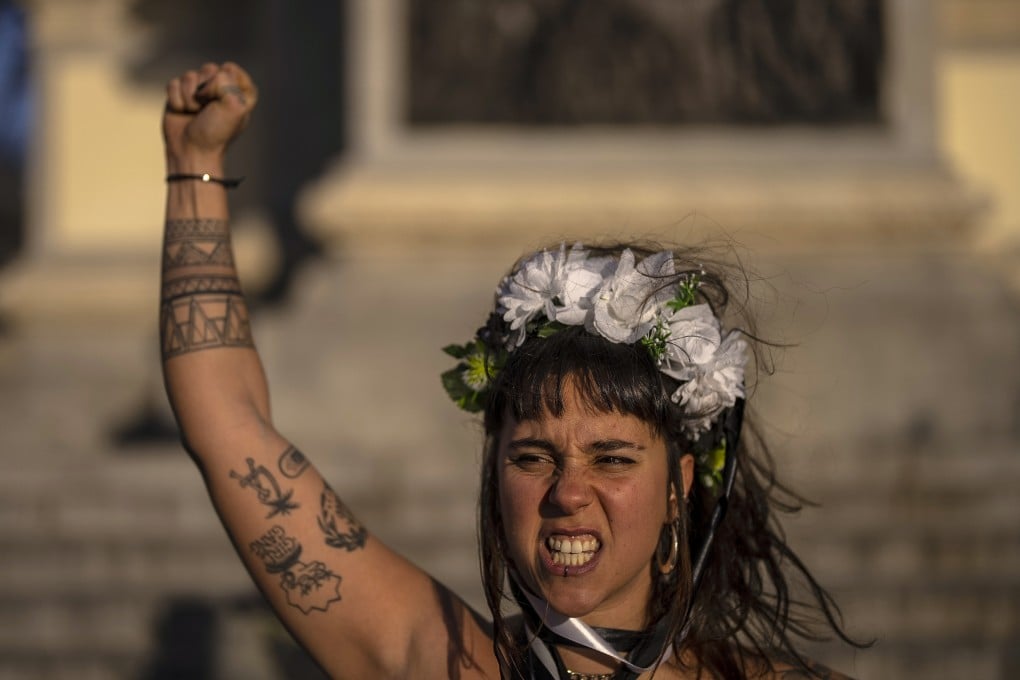 A woman protests against the increased number of femicides in Spain on January 27, 2023. Photo: AP