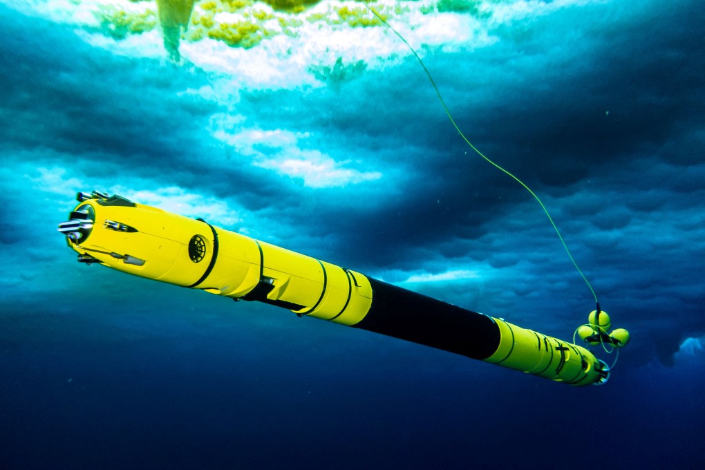 An Icefin is seen in the water as scientists work in the field at the Thwaites glacier in Antarctica. Photo: Becka Bower/Cornell University via Reuters