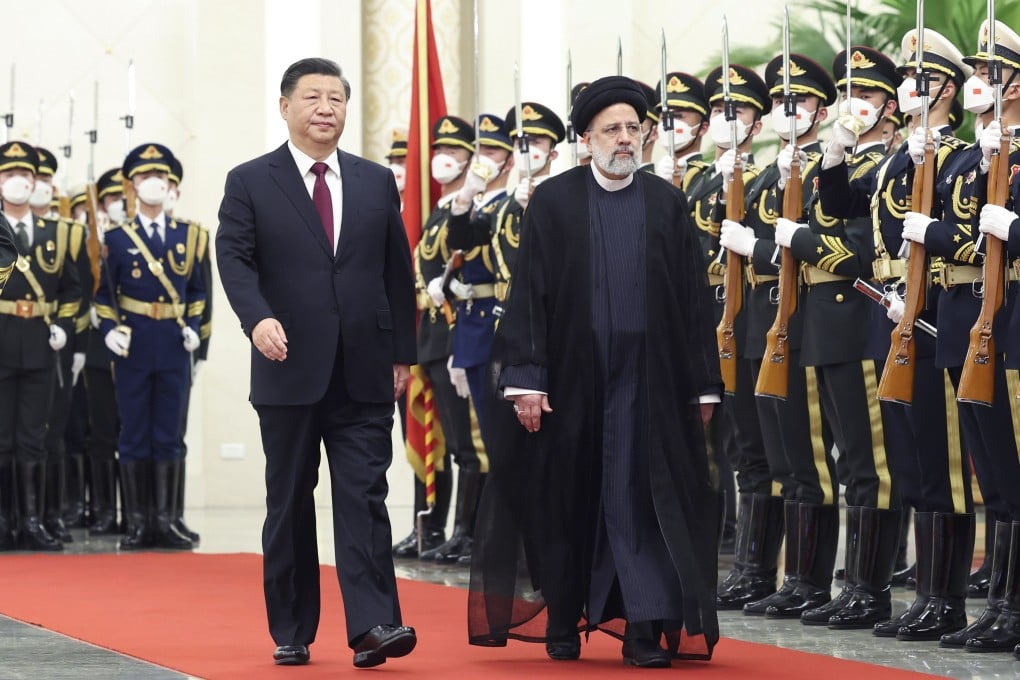 Chinese President Xi Jinping accompanies Iranian President Ebrahim Raisi as he is given a guard of honour ahead of their talks in Beijing on Tuesday. Photo: EPA-EFE