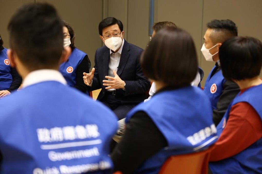 Chief Executive John Lee (centre) attends a briefing during the “Touch Down 1” drill. Photo: Handout