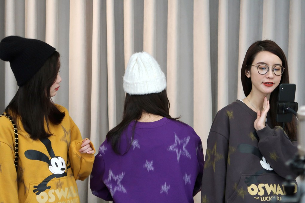Online Chinese celebrity and store owner Zhang Dayi promotes clothing alongside other anchors during a live-streaming session in December 2019. Photo: Reuters