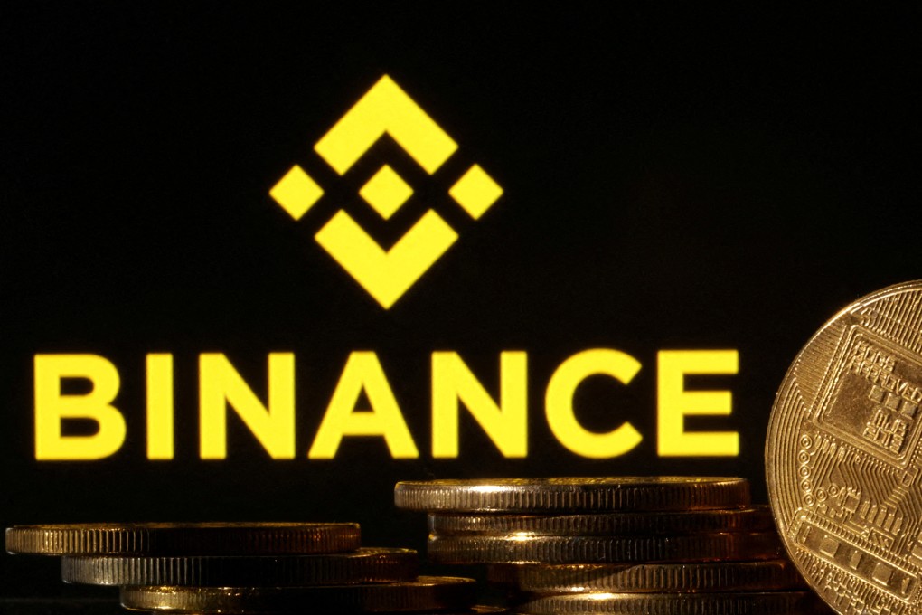 Representations of cryptocurrencies seen in front of a displayed Binance logo in this illustration taken November 10, 2022. Photo: Reuters