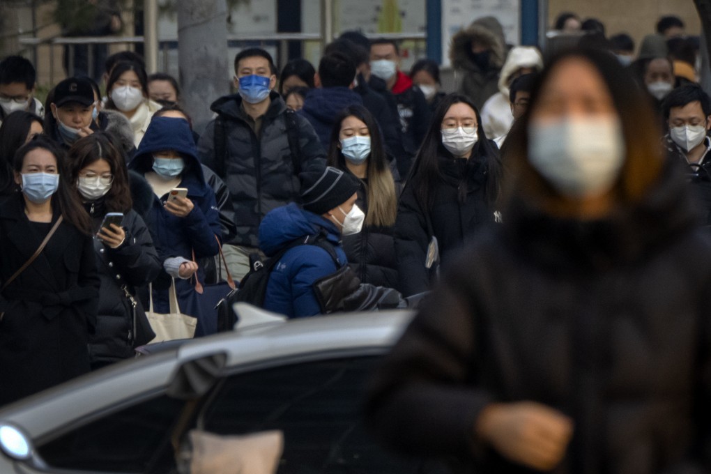 Commuters during the morning rush hour in the central business district in Beijing on Thursday. The Politburo Standing Committee has said the move away from a zero-Covid policy has been “totally correct”. Photo: AP