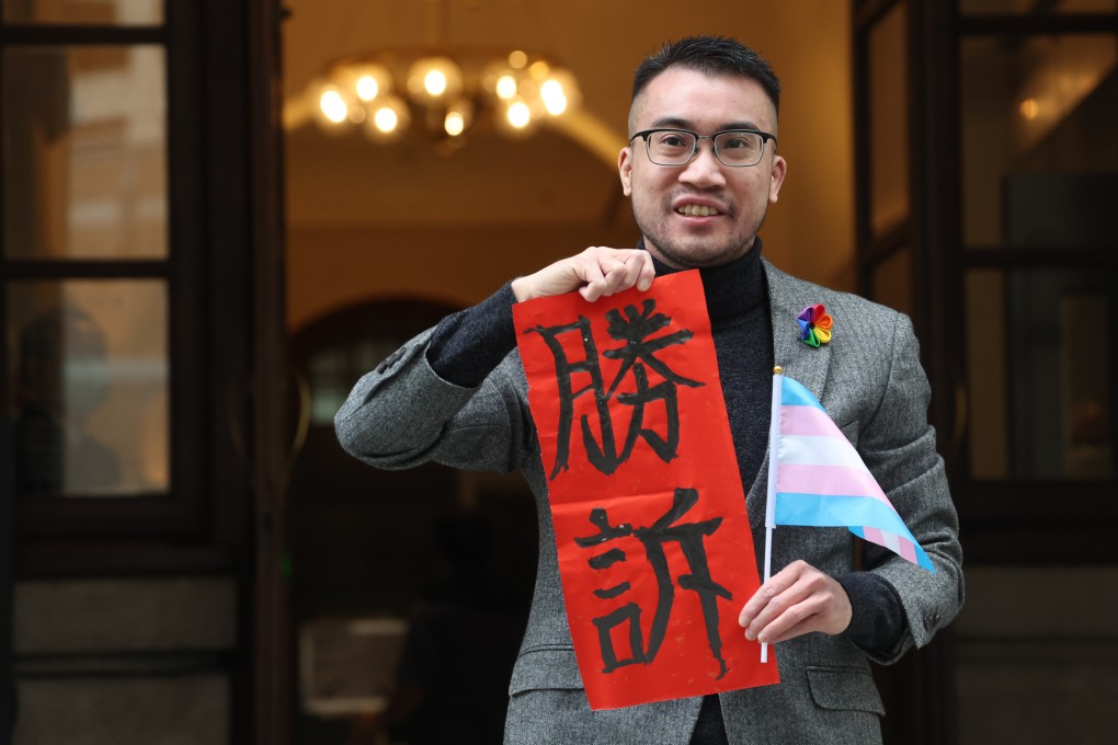 Henry Edward Tse, one of two litigants in the Hong Kong Court of Final Appeal’s ruling on transgender rights, holds a decoration with the Chinese characters for ‘victory’ on February 6. Photo: SCMP/Edmond So