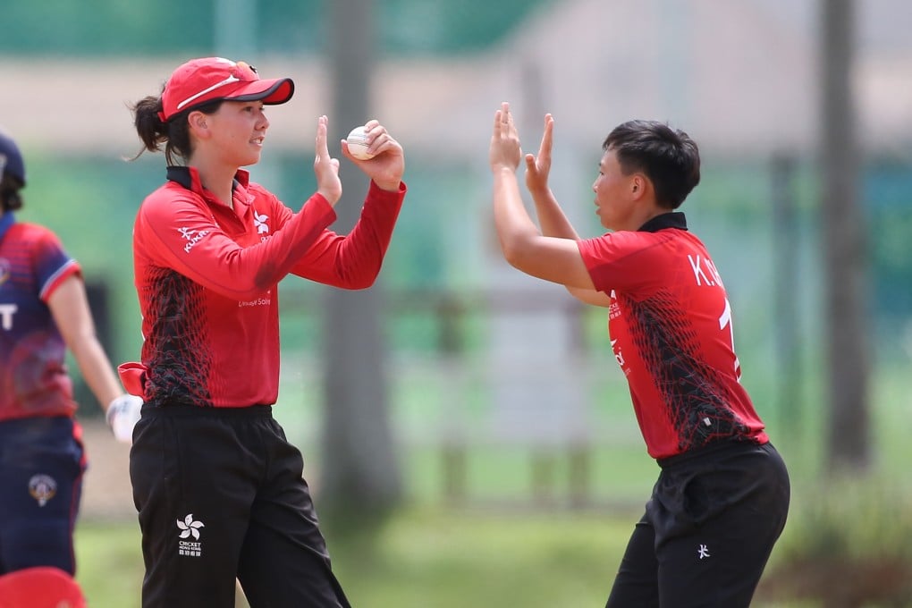 Natasha Miles (left) and Hong Kong captain Kary Chan celebrate after taking the wicket of Priyada Murali during a game in Malaysia. Photo: ACC