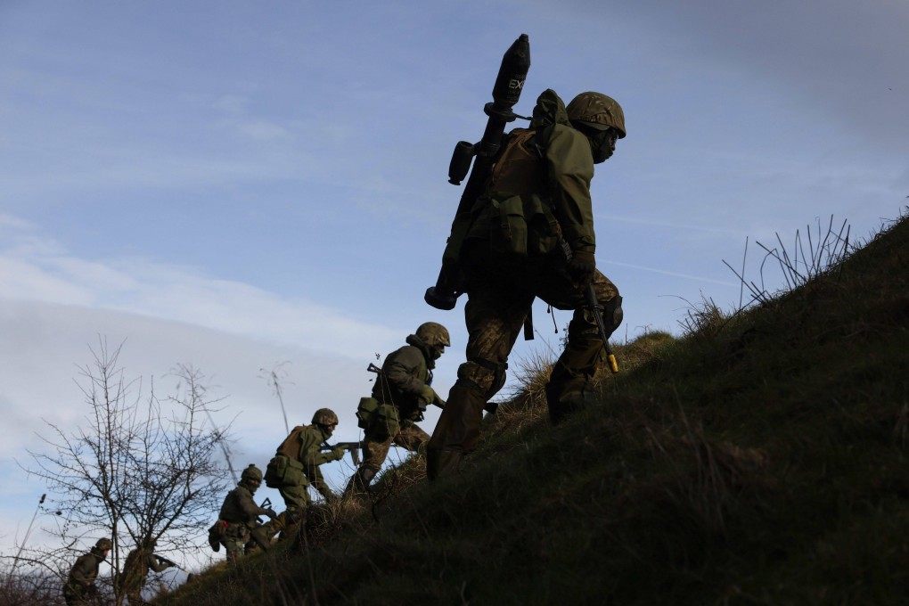 Ukrainian military recruits take part in a trench training in the UK. Photo: Bloomberg