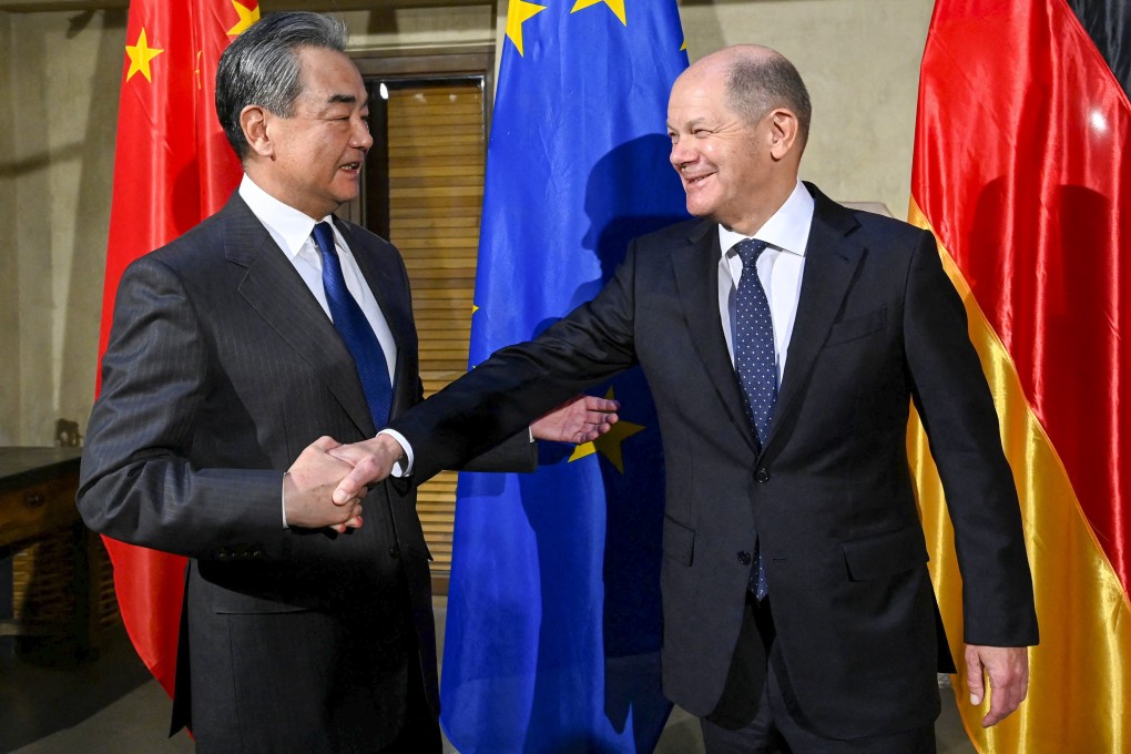German Chancellor Olaf Scholz (right) greets top Chinese diplomat Wang Yi at the Munich Security Conference in Munich, Germany, on Friday. Photo: AFP