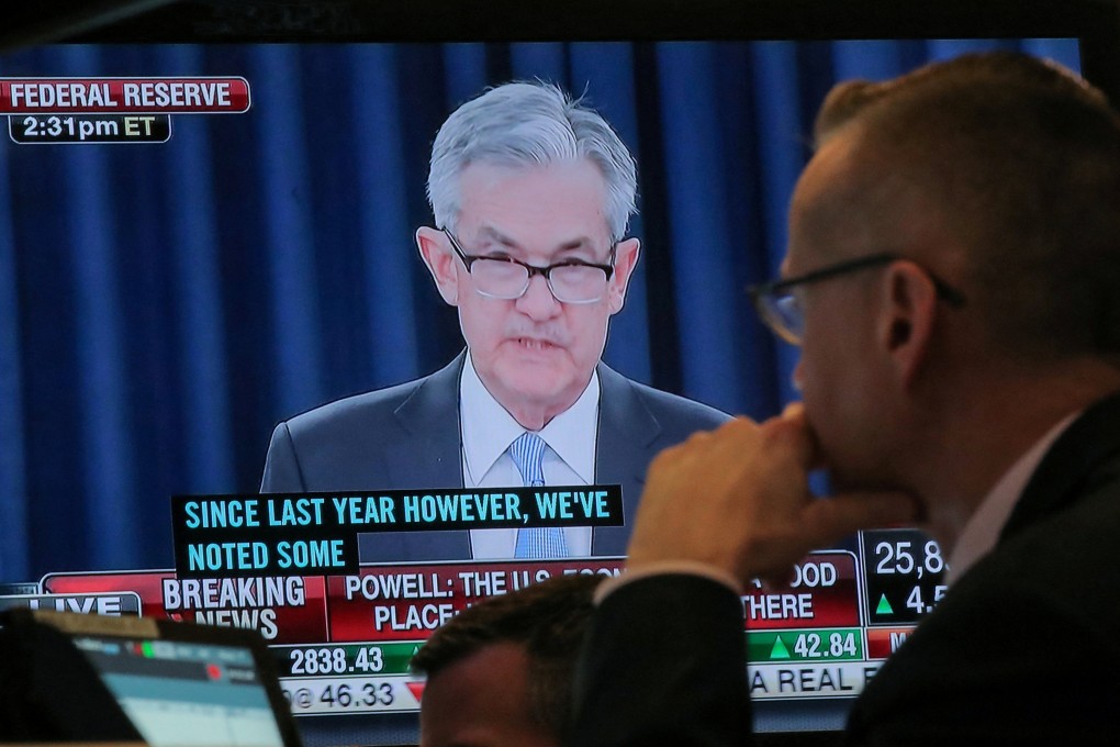 A trader watches US Federal Reserve chairman Jerome Powell on a screen at the New York Stock Exchange. International investors are following the Fed’s lead and selling off US government debt, suggesting ebbing investor confidence as the US Congress is at an impasse over the debt ceiling. Photo: Reuters