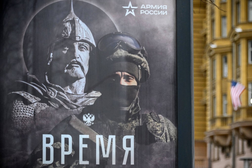 A billboard in Moscow showing a Russian soldier in front of his ancient predecessor. It reads: ‘The Time of Heroes Has Chosen Us’. Photo: AFP