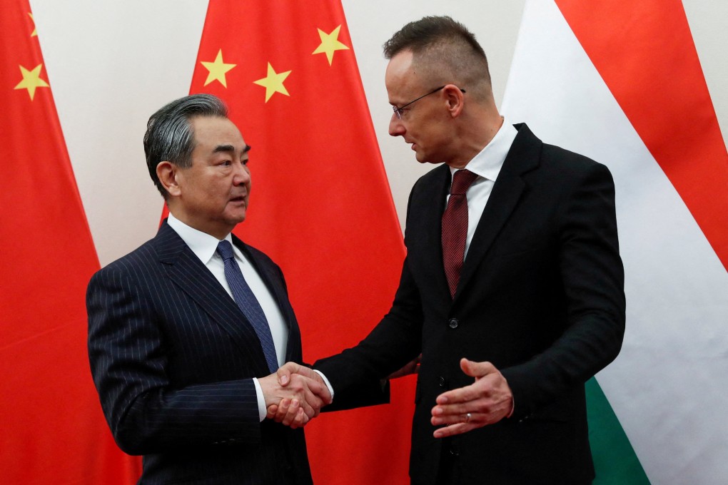 China’s foreign minister Wang Yi shakes hands with Hungarian foreign minister Peter Szijjarto in Budapest, Hungary on Monday. Photo: Reuters