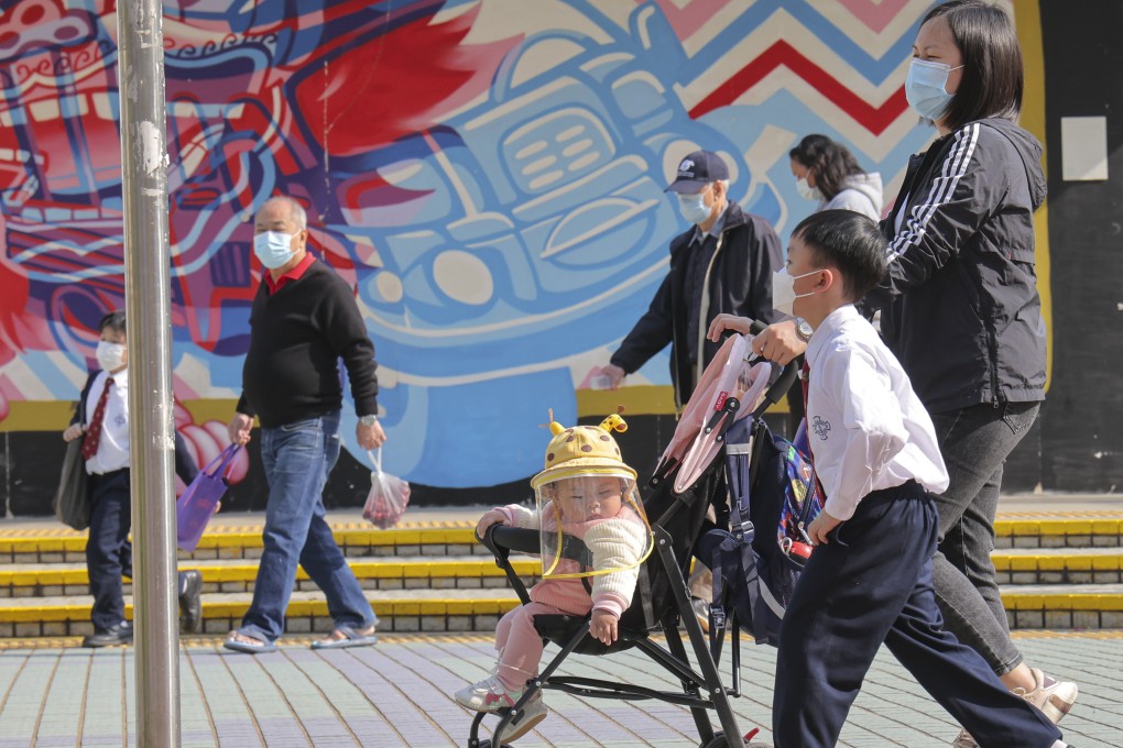 A baby is pushed in a stroller in Cheung Sha Wan. Photo: Jelly Tse