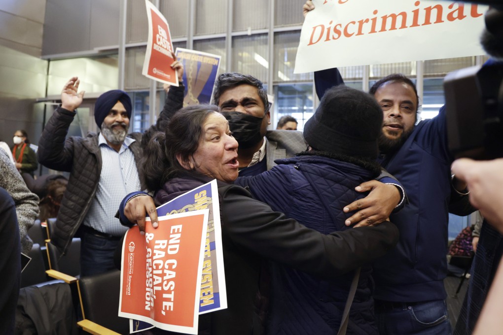 People celebrate the passing of an ordinance to add caste to Seattle’s anti-discrimination laws in the Seattle City Council chambers. Photo: AP