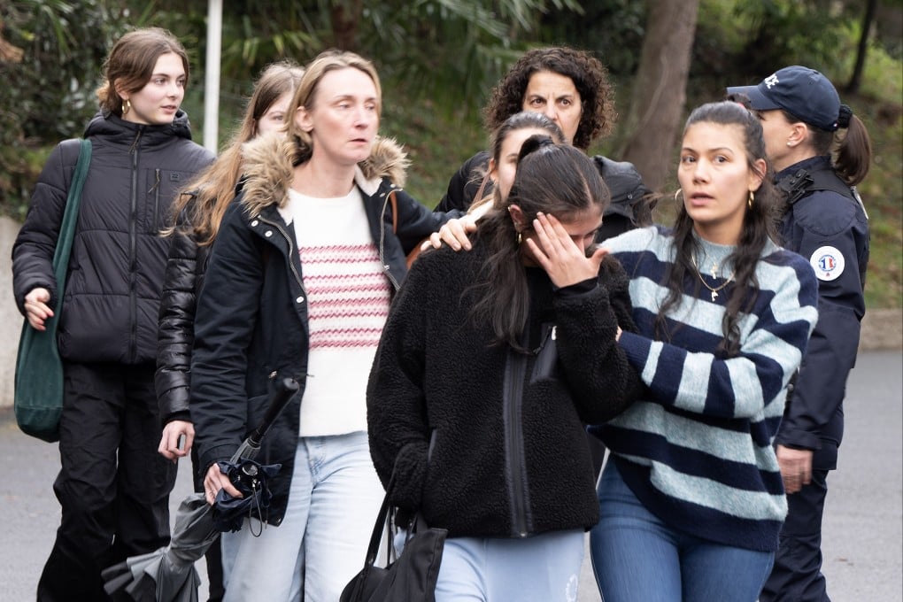 A pupil is comforted as she leaves a school in Saint-Jean-de-Luz, in southwestern France, on Wednesday, after a teacher was fatally stabbed. Photo: EPA-EFE