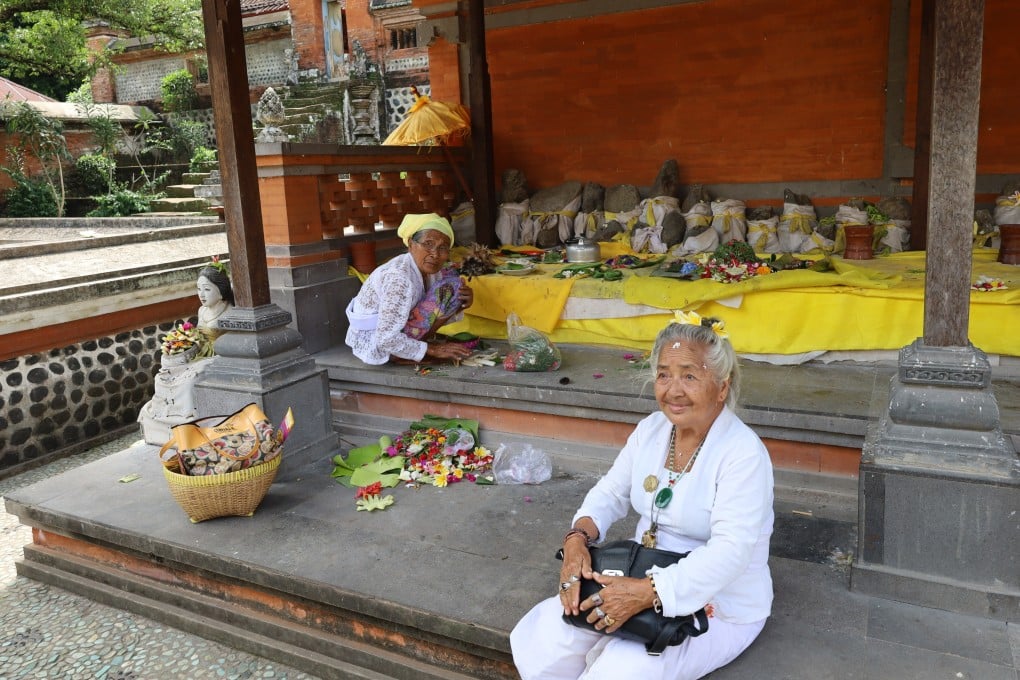 A Muslim and Hindu at Pura Lingsar, a multi-denominational temple on Lombok. The Indonesian island’s lesser-visited areas offer shining examples of peaceful coexistence. Photo: Thomas Bird