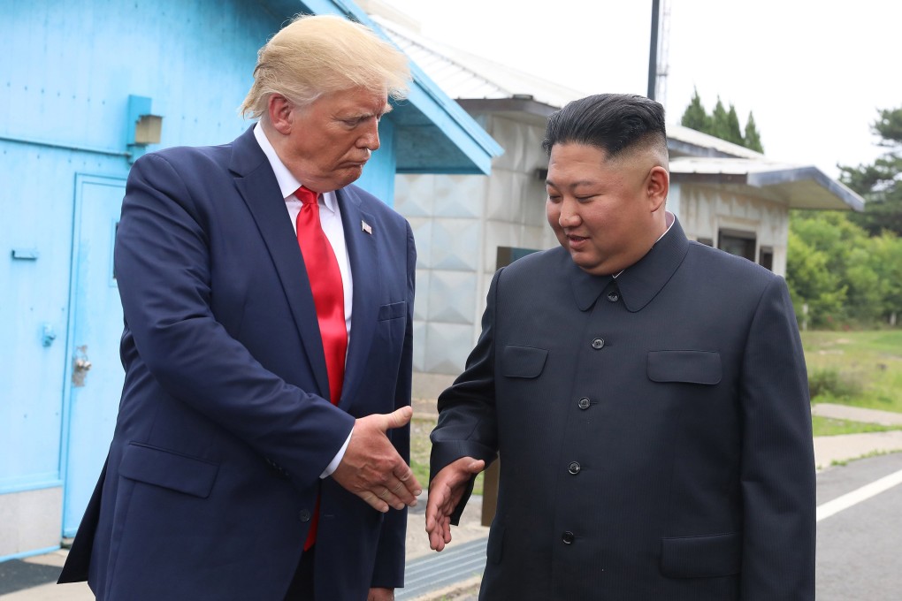 Donald Trump goes to shake hands with North Korean leader Kim Jong-un during a visit to the demilitarised zone separating the two Koreas in 2019. Photo: Dong-A Ilbo/Getty Images/TNS
