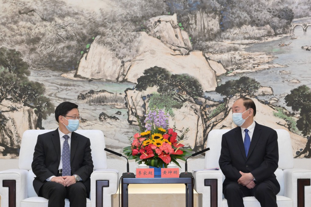 John Lee (left) and Guangdong party secretary Huang Kunming  in Guangzhou. Photo: Handout
