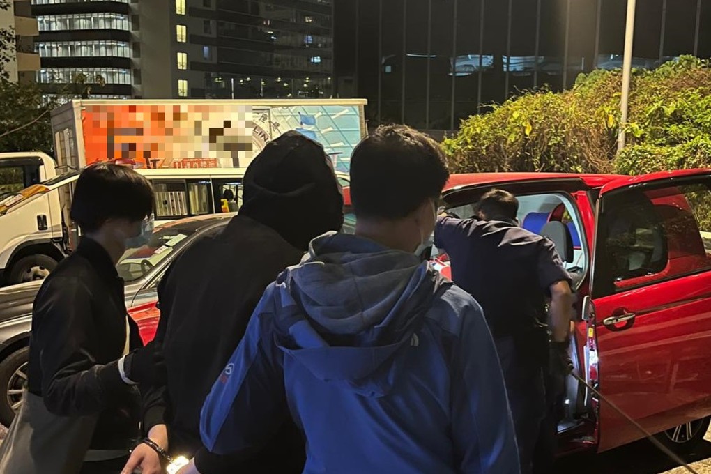 Police in Kwai Chung on Wednesday night escorting one of the suspects. Photo: Handout