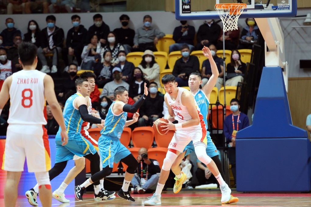 China’s Zhou Qi (second from right) tries to find a way to the basket against Kazakhstan during their Fiba World Cup World Cup 2023 Asian Qualifiers at Tsuen Wan Sports Centre. Photo: Mike Chan
