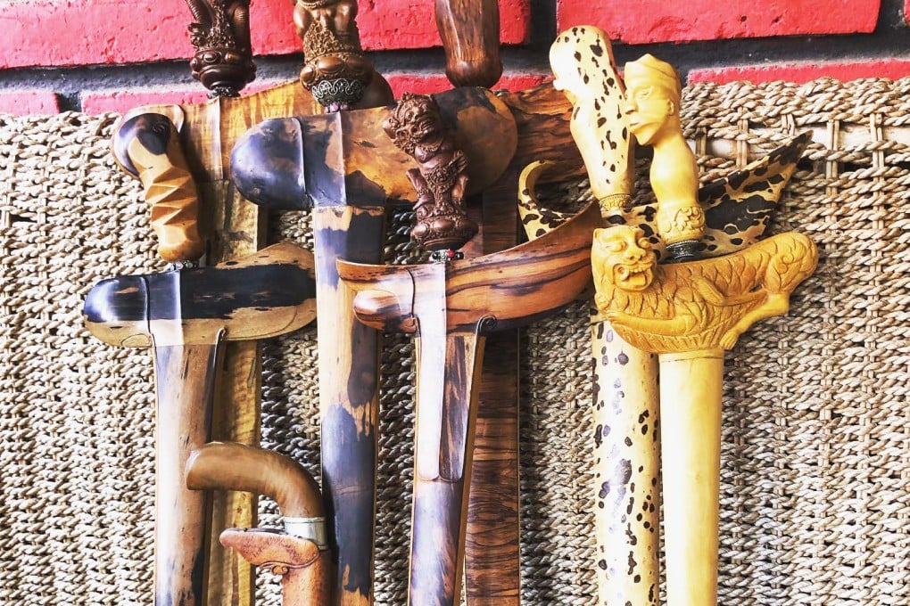 An array of Bara’s krisses with finely sculpted hilts in wooden sheaths. Photo: Lembu Bara