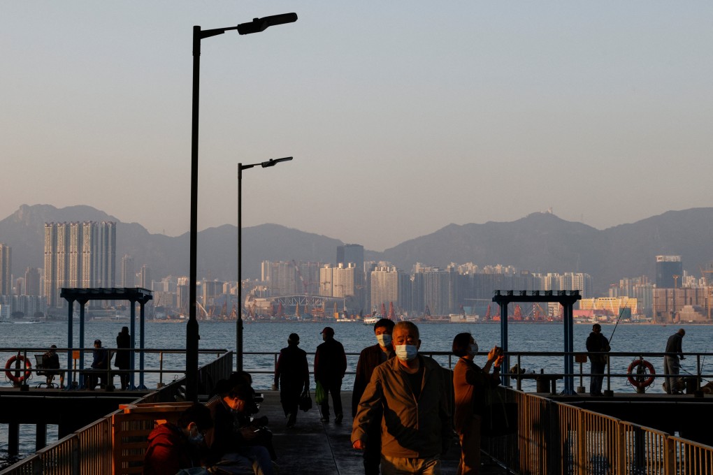 People wear masks at a pier in Hong Kong. Photo: Reuters