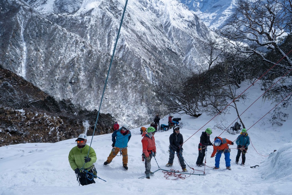 Trainees from the Khumbu Climbing Centre  in Phortse, Nepal, the village with more Everest summiteers than anywhere else, are put through their paces. The centre has given many Sherpas professional climbing and safety skills, making it easier for them to get hired for expeditions. Photo: Amrit Ale