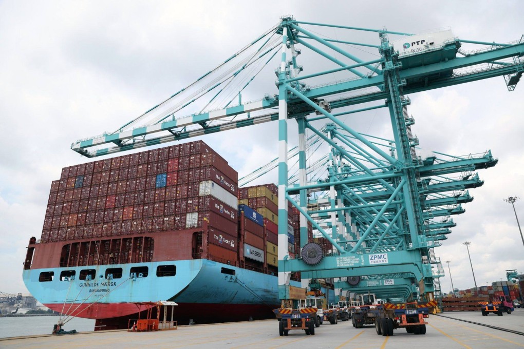 A container ship is seen docked at the Port of Tanjung Pelepas in Malaysia. Falling exports are constricting in growth in much of Asia. Photo: Bloomberg