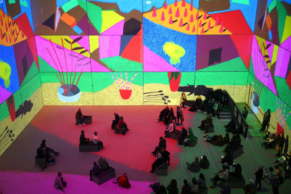 David Hockney, is still painting at 85, and his latest exhibition (above) is a 50-minute multisensory experience, taking viewers through his paintings from Los Angeles in the 1960s as well as artworks from Normandy, painted during Covid lockdown. Photo: Daniel Leal/AFP