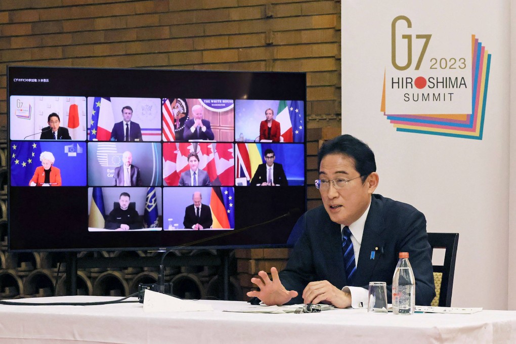 Japan’s Prime Minister Fumio Kishida (right) attends an online meeting with leaders of the G7 group at the prime minister’s official residence in Tokyo. Photo: Cabinet Public Affairs Office of Japan/AFP