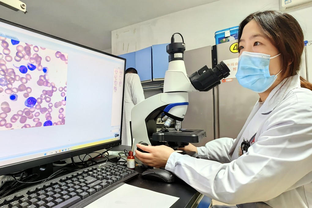 A Xinqiao Hospital researcher at Army Medical University in Chongqing checks the results made by an artificial intelligence model for blood cell testing. Photo:  Handout via Xinhua