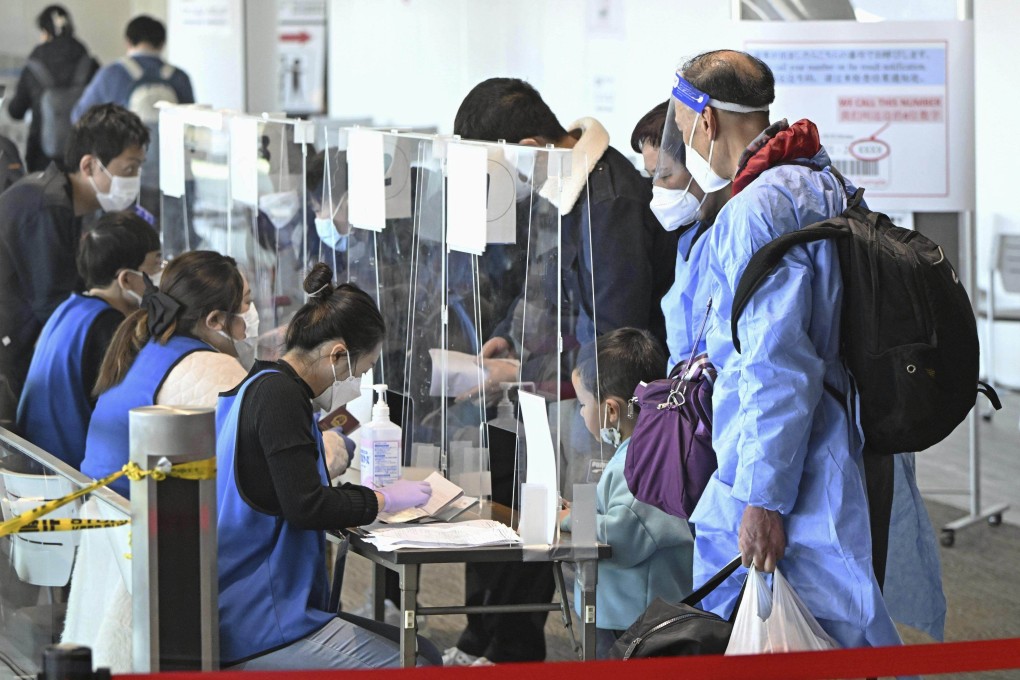 Passengers from Shanghai present proof of a negative Covid-19 test on their arrival at Japan’s Narita airport on January 8. Photo: via AP