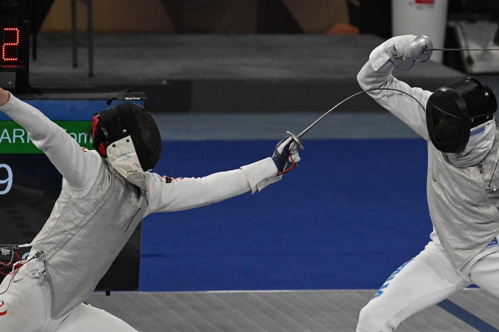 Ryan Choi (left) against world number one Tommaso Marini of Italy in the team competition of the World Cup series in Cairo. Photo: FIE
