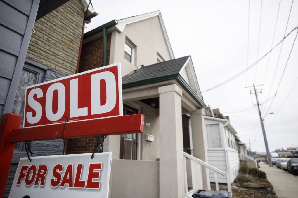 A “Sold” sign is seen in front of a home in Toronto, Canada, on March 11, 2021. Photo: Bloomberg