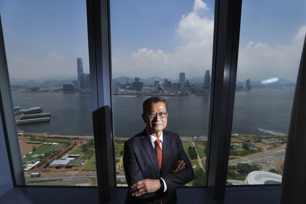 Financial Secretary Paul Chan at government’s headquarters in Admiralty, with the Kowloon skyline in the background, on July 25, 2022. Photo: Nora Tam