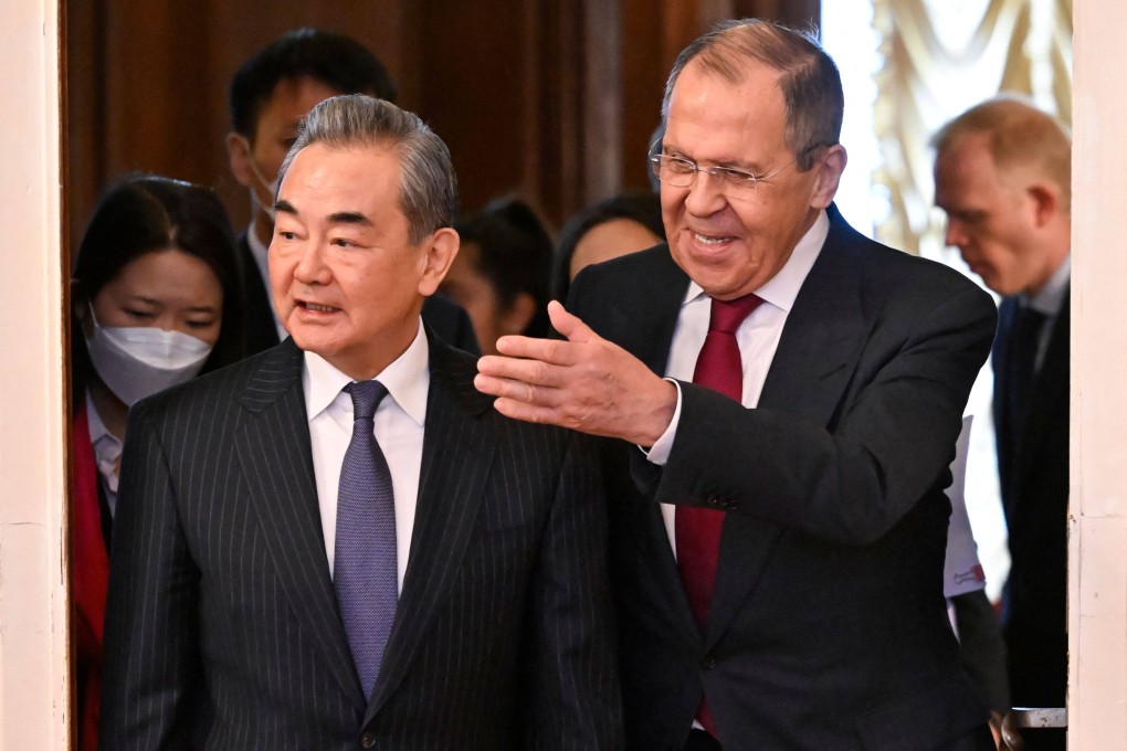 Russian Foreign Minister Sergei Lavrov and China’s top diplomat Wang Yi enter a hall during a meeting in Moscow on February 22. Photo: AFP