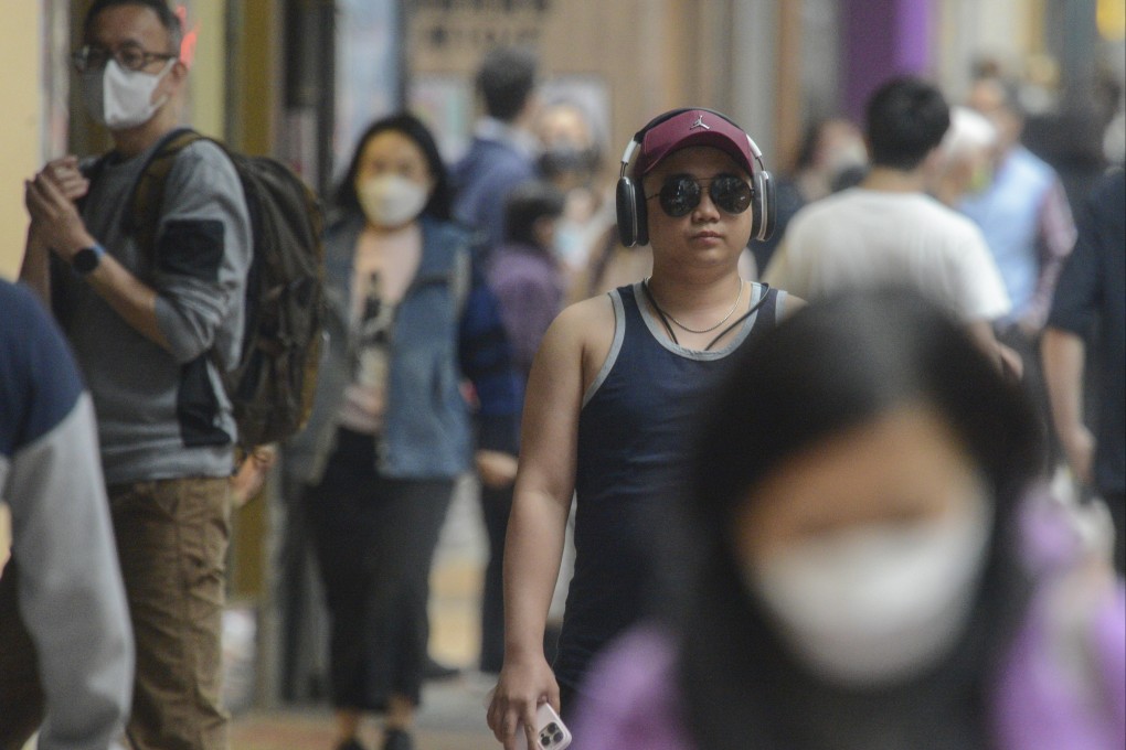 Pedestrians walk through the Causeway Bay district of Hong Kong on February 3. Photo: Antony Dickson