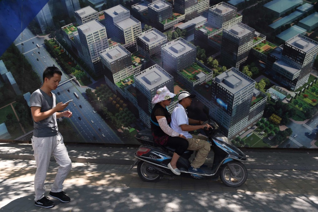 A billboard advertisement for a commercial and residential complex in Beijing. Property bonds carried the junk-bond market rally from October. Photo: AFP