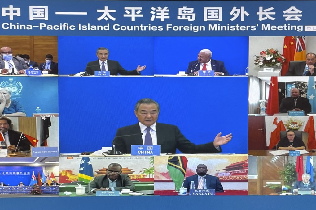 China’s then foreign minister, Wang Yi (centre), appears virtually with representatives of several South Pacific countries last year when dozens of bilateral deals were signed. Photo: AP