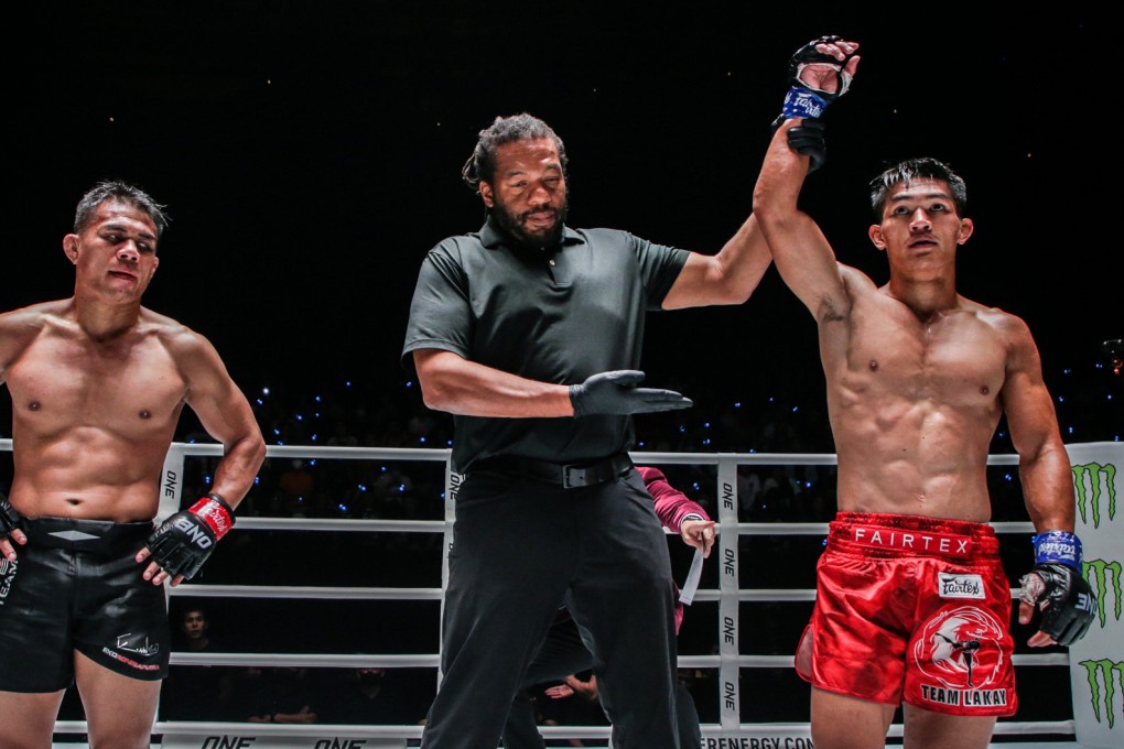 Danny Kingad’s hand is raised by referee Herb Dean after his win over Eko Roni Saputra. Photos: ONE Championship