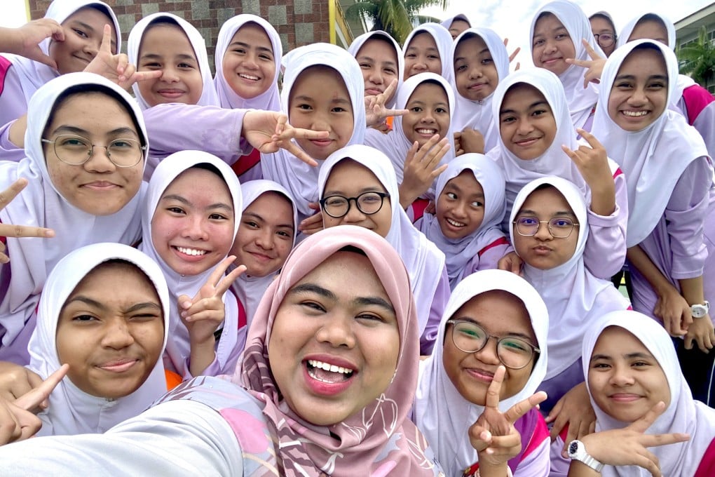 Malaysian teacher Nura Ezzatie (front), who teaches Korean, with some of her students. Photo: Handout