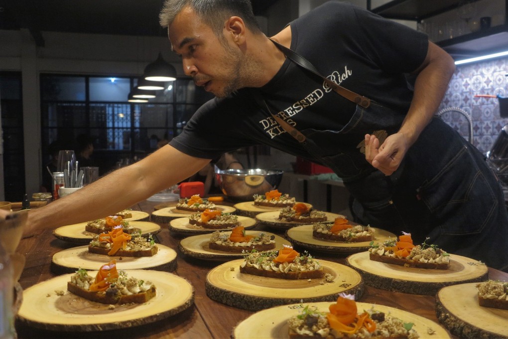 Chef Steven John prepares dishes flavoured with cannabis for a private dinner in Bangkok, Thailand. Photo: Empty Plates