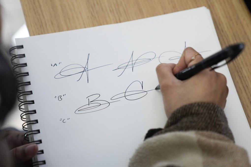 Priscilla Molina creates a custom signature in Los Angeles on February  22, 2023. Molina designs a minimum of 300 custom signatures a month. Photo: AP