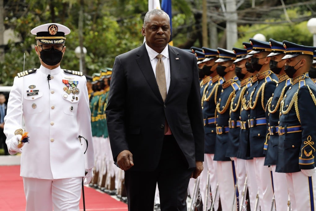 US Defence Secretary Lloyd Austin (right) walks past military guards during arrival honours at Camp Aguinaldo in Manila in February. The US recently has bolstered ties with allies such as the Philippines to counter China. Photo: Getty Images via TNS