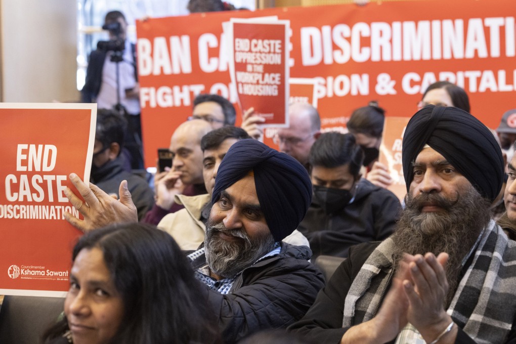 People applaud Seattle banning caste discrimination at a city council meeting last month. Photo: TNS